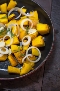 Pumpkin pan in cast iron pan on wood stove Pumpkin pan in cast iron pan on wood stove